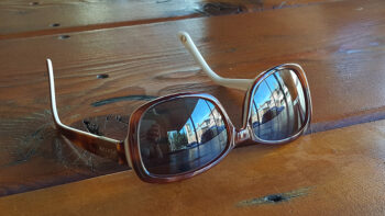 Sunglasses on table by Jennifer Mosher - thumbnail
